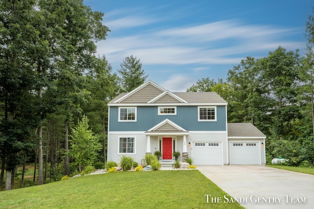 568 N River Hills Dr, Newaygo, MI 49337 - view of front of home featuring concrete driveway, an attached garage, and a front yard