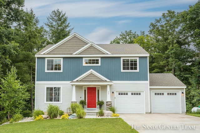 568 N River Hills Dr, Newaygo, MI 49337 - view of front of property with driveway, a front yard, a garage, and roof with shingles