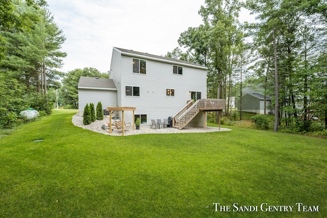 568 N River Hills Dr, Newaygo, MI 49337 - rear view of property featuring stairs, a lawn, and a wooden deck