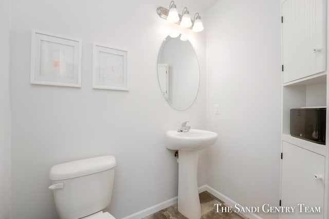 568 N River Hills Dr, Newaygo, MI 49337 - bathroom with toilet and baseboards