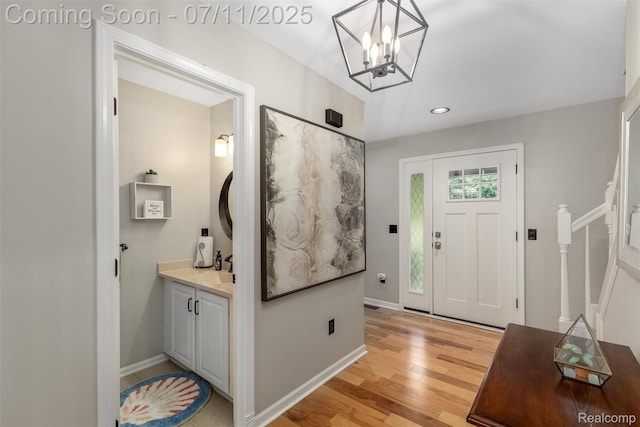 2661 Nottingham, Waterford, MI 48329 - entrance foyer featuring light wood-style floors, recessed lighting, and a chandelier