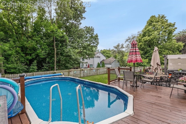 2661 Nottingham, Waterford, MI 48329 - view of pool with a deck, outdoor dining area, and a fenced backyard