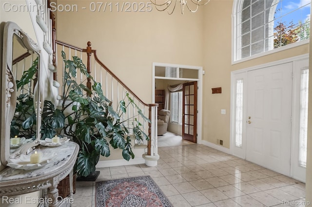 3565 Heron Ridge Dr, Rochester Hills, MI 48309 - tiled foyer with a towering ceiling, a chandelier, and stairs