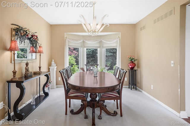 3565 Heron Ridge Dr, Rochester Hills, MI 48309 - dining area featuring light carpet and a chandelier