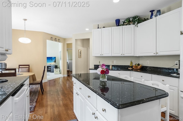 3565 Heron Ridge Dr, Rochester Hills, MI 48309 - kitchen with dark wood-type flooring, white cabinetry, a center island, recessed lighting, and hanging light fixtures