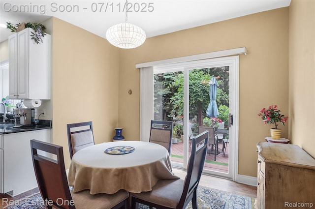 3565 Heron Ridge Dr, Rochester Hills, MI 48309 - dining space with light wood-style floors and baseboards