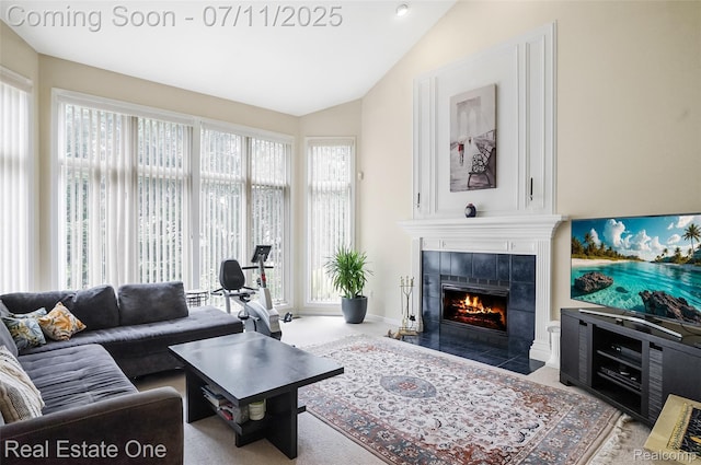3565 Heron Ridge Dr, Rochester Hills, MI 48309 - living area with lofted ceiling, a tile fireplace, and plenty of natural light