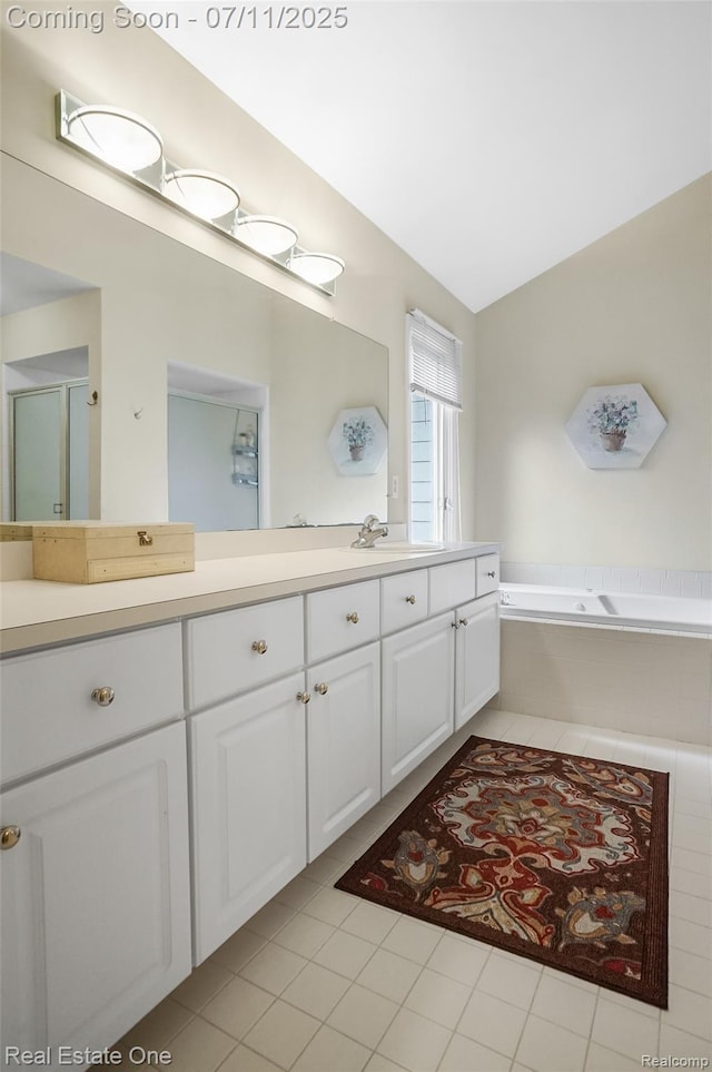 3565 Heron Ridge Dr, Rochester Hills, MI 48309 - full bathroom with double vanity, a bath, and tile patterned floors
