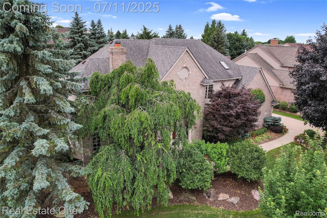 3565 Heron Ridge Dr, Rochester Hills, MI 48309 - view of home's exterior featuring roof with shingles