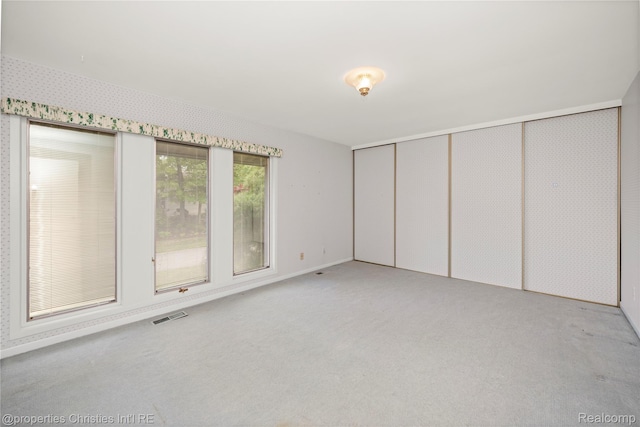 4724 Tara Ct, West Bloomfield, MI 48323 - unfurnished bedroom featuring light colored carpet and a closet
