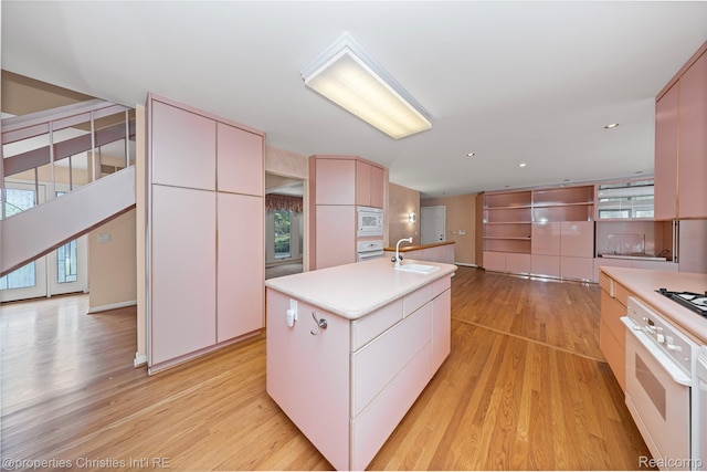 4724 Tara Ct, West Bloomfield, MI 48323 - kitchen featuring white appliances, light wood-style flooring, healthy amount of natural light, modern cabinets, and recessed lighting