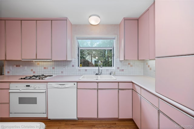 4724 Tara Ct, West Bloomfield, MI 48323 - kitchen with white appliances, light countertops, and backsplash