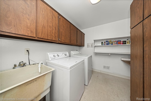 4724 Tara Ct, West Bloomfield, MI 48323 - washroom featuring cabinet space, washer and clothes dryer, and light floors