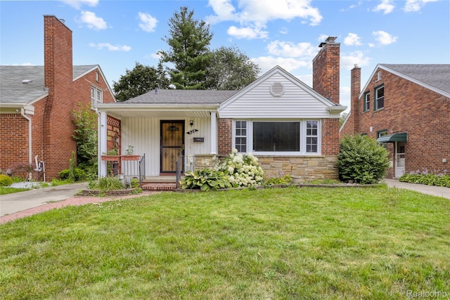 928 N Denwood St, Dearborn, MI 48128 - view of front of property featuring a porch, a front lawn, stone siding, and a chimney
