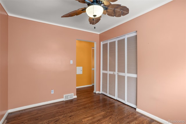 928 N Denwood St, Dearborn, MI 48128 - unfurnished bedroom with a closet, wood finished floors, crown molding, and ceiling fan