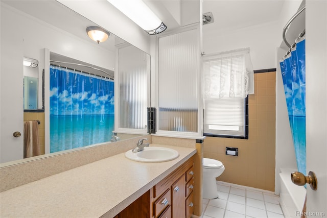 928 N Denwood St, Dearborn, MI 48128 - bathroom with tile walls, vanity, tile patterned floors, and crown molding
