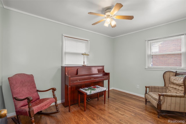 928 N Denwood St, Dearborn, MI 48128 - living area featuring crown molding, a ceiling fan, and wood finished floors