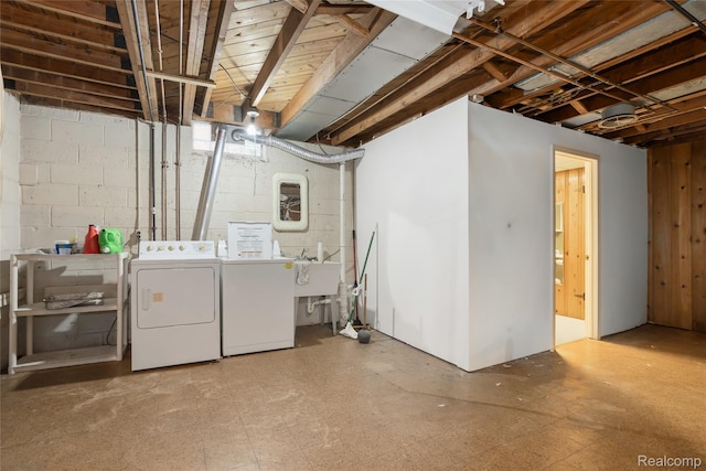 928 N Denwood St, Dearborn, MI 48128 - unfinished below grade area featuring independent washer and dryer, concrete block wall, and tile patterned floors