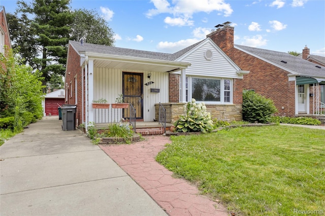 928 N Denwood St, Dearborn, MI 48128 - view of front facade featuring a porch, a front yard, a chimney, a shingled roof, and board and batten siding