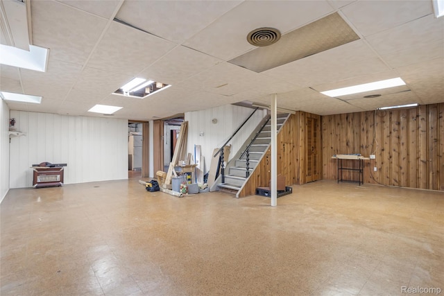 928 N Denwood St, Dearborn, MI 48128 - finished below grade area featuring a paneled ceiling, tile patterned floors, stairs, and wood walls