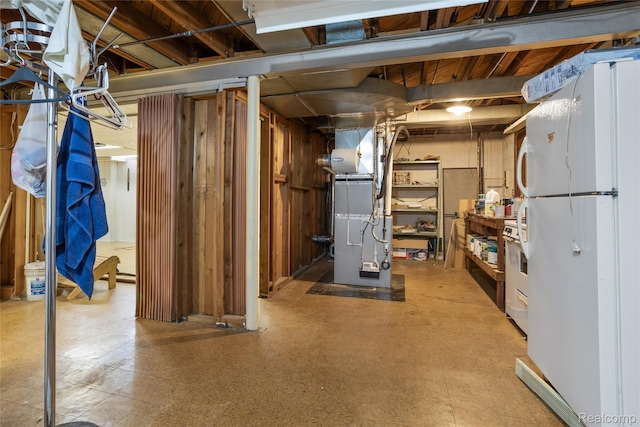 928 N Denwood St, Dearborn, MI 48128 - unfinished below grade area with freestanding refrigerator, heating unit, and tile patterned floors