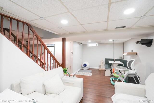5720 Argyle St, Dearborn, MI 48126 - living room with wood finished floors, recessed lighting, a drop ceiling, and stairway