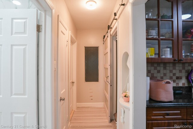 5720 Argyle St, Dearborn, MI 48126 - hallway with a barn door and light wood finished floors