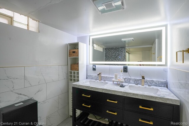 5720 Argyle St, Dearborn, MI 48126 - full bathroom featuring tile walls, double vanity, and wainscoting