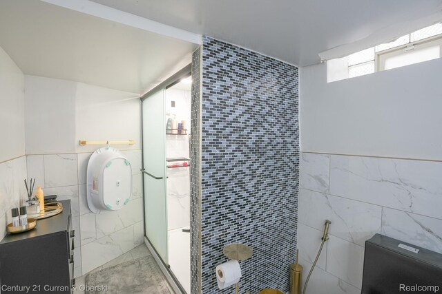5720 Argyle St, Dearborn, MI 48126 - bathroom with tile walls, marble finish flooring, and vanity
