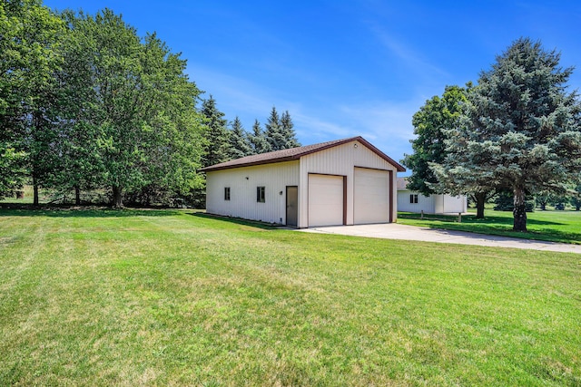6580 Sunflower Dr SW, Byron Center, MI 49315 - view of property exterior featuring a garage, an outdoor structure, and a yard