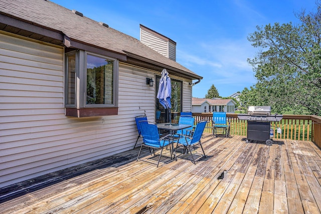 6580 Sunflower Dr SW, Byron Center, MI 49315 - deck featuring outdoor dining space and area for grilling