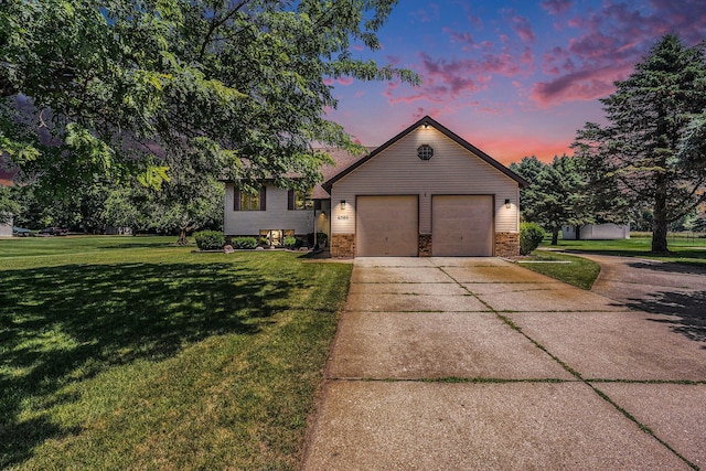 6580 Sunflower Dr SW, Byron Center, MI 49315 - view of front facade featuring concrete driveway, a front yard, an attached garage, and brick siding