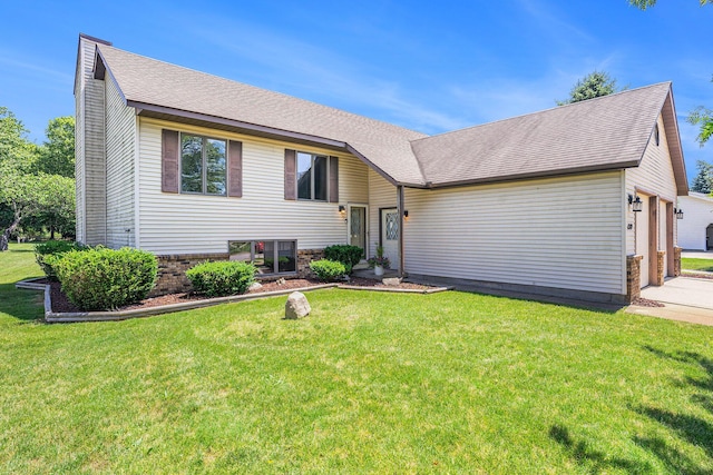 6580 Sunflower Dr SW, Byron Center, MI 49315 - split level home with a front lawn, driveway, a garage, brick siding, and a shingled roof