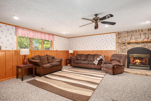 6580 Sunflower Dr SW, Byron Center, MI 49315 - living room featuring wainscoting, carpet, wooden walls, ceiling fan, and wallpapered walls