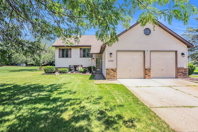 6580 Sunflower Dr SW, Byron Center, MI 49315 - split level home with a front yard, brick siding, and roof with shingles