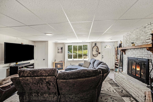 12972 S M 43 Hwy, Delton, MI 49046 - living room with a paneled ceiling and a brick fireplace
