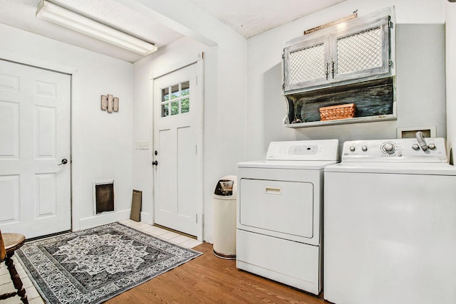 12972 S M 43 Hwy, Delton, MI 49046 - washroom featuring washer and clothes dryer and light wood finished floors