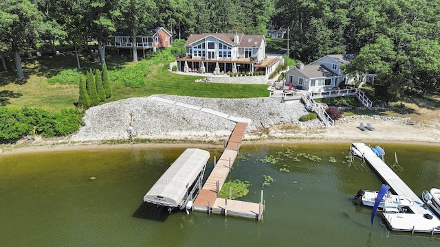 481 Seminole Rd, Norton Shores, MI 49444 - dock featuring a yard and a deck with water view