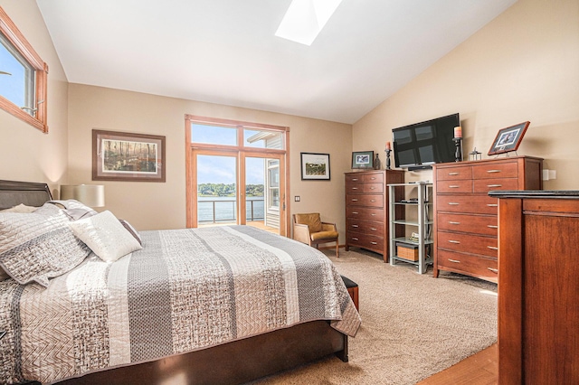 481 Seminole Rd, Norton Shores, MI 49444 - bedroom featuring access to exterior, a skylight, and lofted ceiling