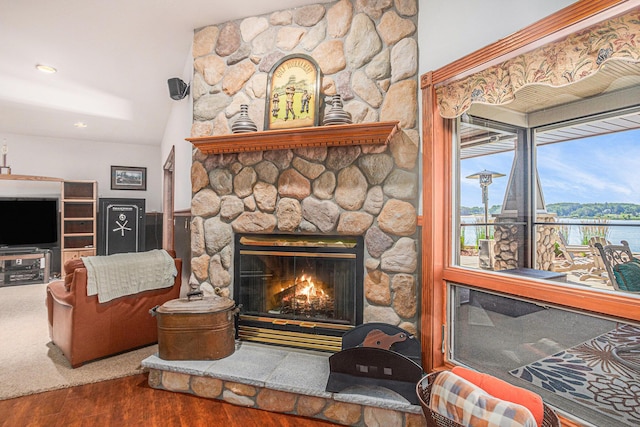 481 Seminole Rd, Norton Shores, MI 49444 - detailed view of wood finished floors, a fireplace, and recessed lighting