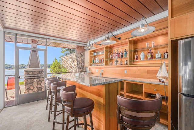481 Seminole Rd, Norton Shores, MI 49444 - indoor wet bar featuring freestanding refrigerator, light colored carpet, a wall of windows, a water view, and wooden ceiling