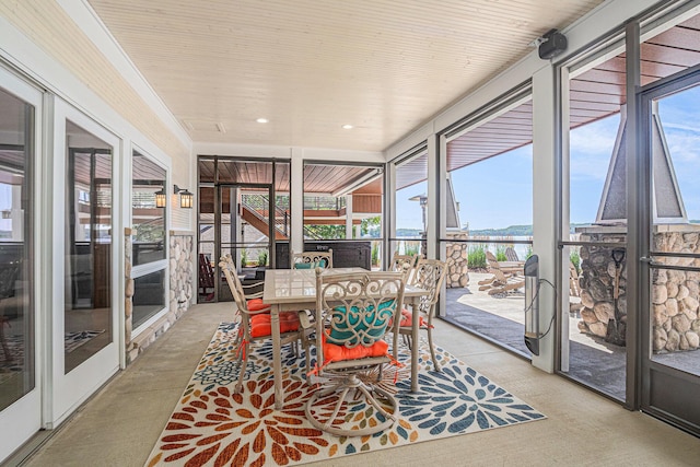 481 Seminole Rd, Norton Shores, MI 49444 - sunroom / solarium featuring a water view, outdoor dining space, floor to ceiling windows, and recessed lighting