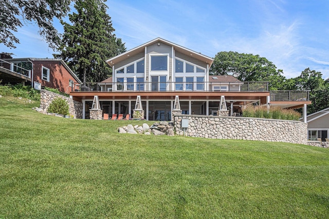 481 Seminole Rd, Norton Shores, MI 49444 - back of house with a lawn, a deck, and stone siding