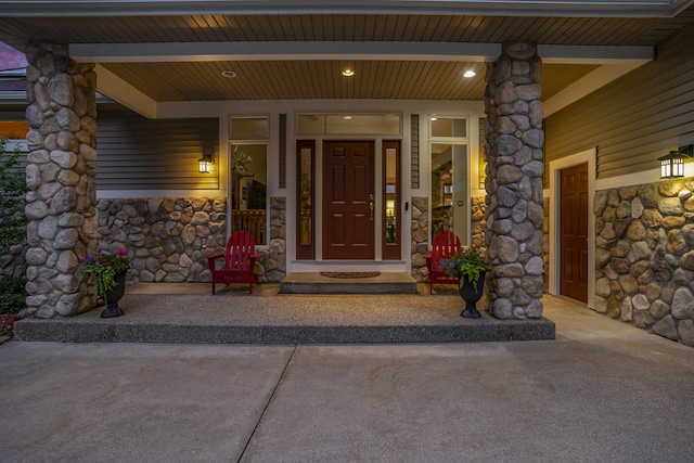 481 Seminole Rd, Norton Shores, MI 49444 - view of exterior entry with stone siding and covered porch