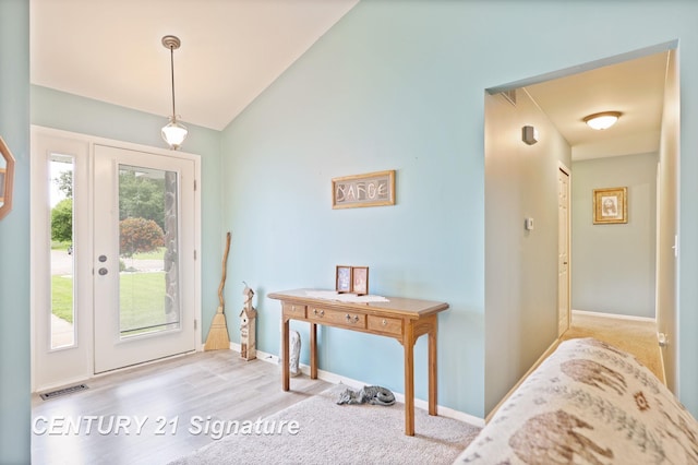 11315 Grand Oaks Dr, Clio, MI 48420 - foyer entrance featuring vaulted ceiling and baseboards