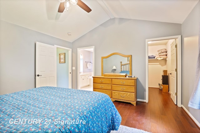 11315 Grand Oaks Dr, Clio, MI 48420 - bedroom with a spacious closet, dark wood-type flooring, lofted ceiling, ensuite bath, and a ceiling fan