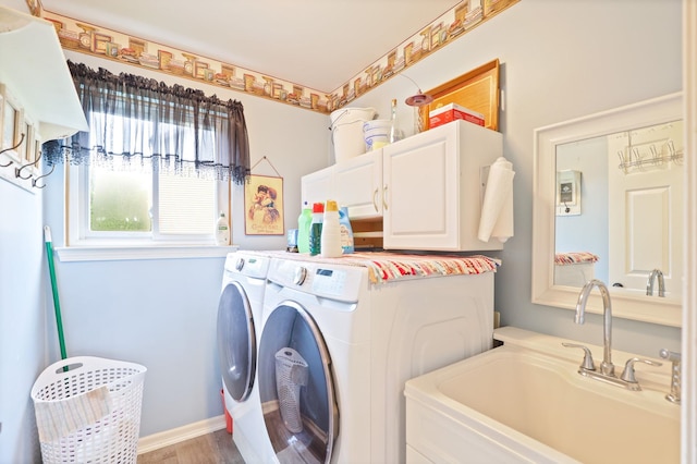 11315 Grand Oaks Dr, Clio, MI 48420 - washroom with cabinet space, separate washer and dryer, and wood finished floors