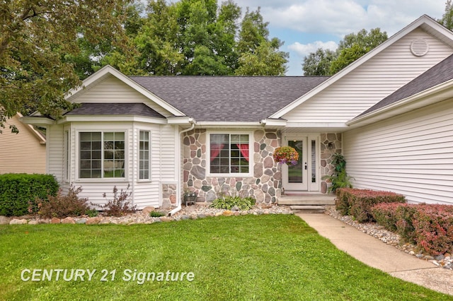 11315 Grand Oaks Dr, Clio, MI 48420 - ranch-style home featuring a shingled roof, a front yard, and stone siding