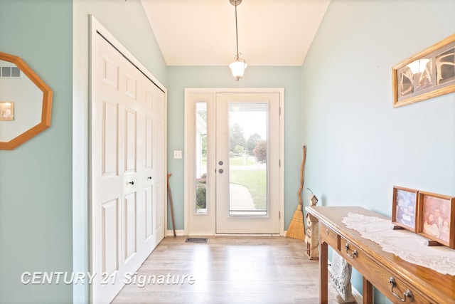 11315 Grand Oaks Dr, Clio, MI 48420 - foyer entrance featuring vaulted ceiling and wood finished floors