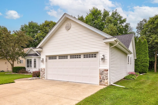 11315 Grand Oaks Dr, Clio, MI 48420 - single story home featuring stone siding, concrete driveway, an attached garage, and a front yard